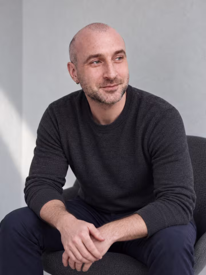 Vladi Volodko seated and looking to the side
